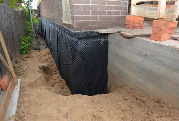 Happy homeowners after waterproofing job in Little Silver